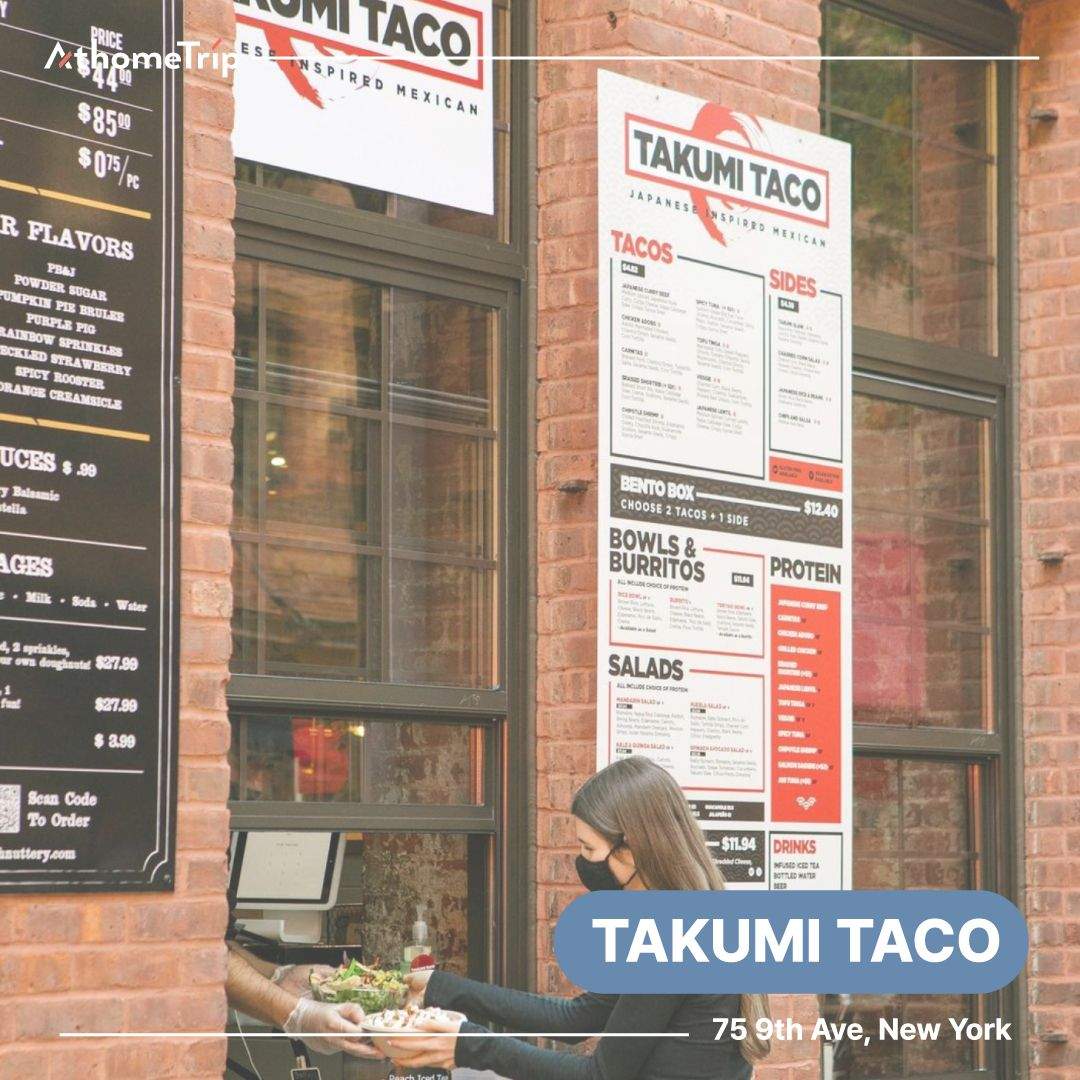벽돌 벽과 유리창에 TAKUMI TACO 문구가 적힌 식당 외부 전경